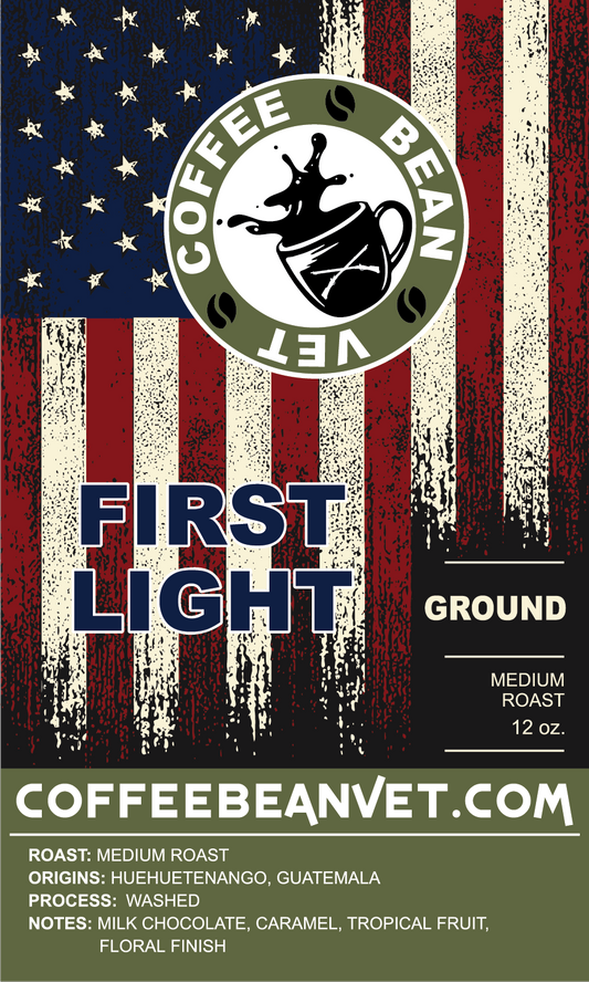 Coffee Bean & Vet's First Light medium roast coffee packaging featuring a graphic design with American flag colors and the product name 'First Light' prominently displayed.